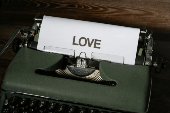 A piece of paper with the word LOVE typed on a typewriter.