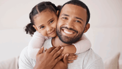 How Stepdads Positively Impact Mental Health - stepdaughter with her arms around her stepdads neck