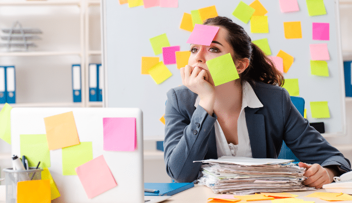 National Workaholics Day - Women with paperwork and post it