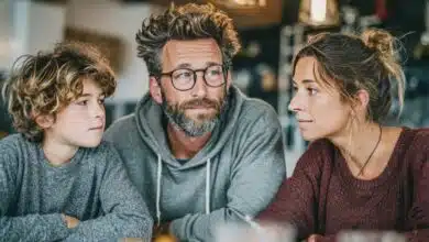 how to talk to kids about school shootings-Family discussing serious topic at dinner table