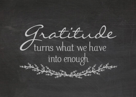 gratitude quote on dusty black chalkboard