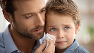 stepfather when biological father is absent - Stepdad comforting crying stepson-stepfather when biological father is absent - Stepdad comforting crying stepson
