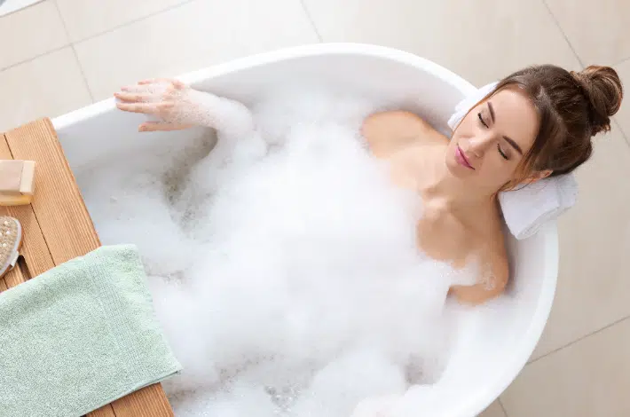 National Bubble Bath Day - a woman in a bubble bath