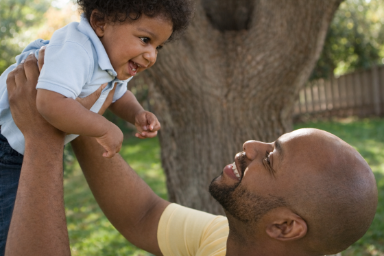 Stepdad lifting stepson