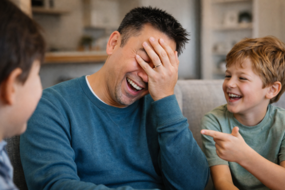 A playful, exaggerated “facepalm” or mock-exasperated stepdad moment—clearly affectionate, not stressed.