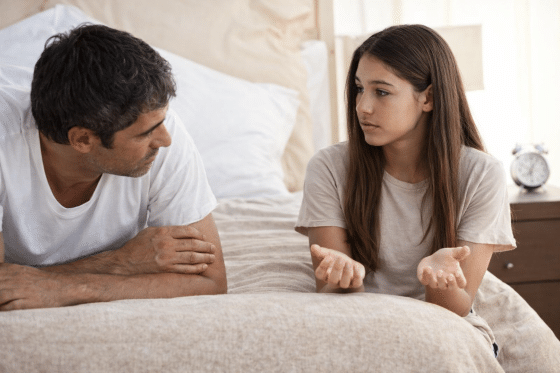 Stepdad earnestly listening to his stepdaughter