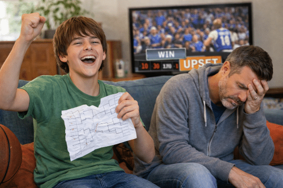 March Madness with your stepkids - Stepson-celebrating-his-bracket-victory-over-his-stepdad.