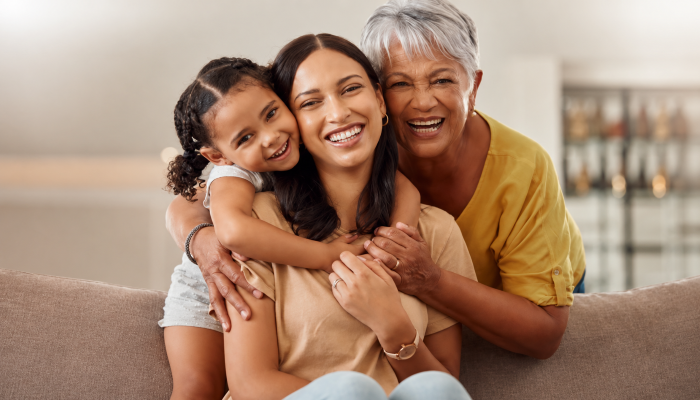 Mother’s Day tribute to mothers - Grandmother, mom and Mother's Day tribute to mothers - Grandmother, mom and child hug in a portrait for mothers day on a house sofa