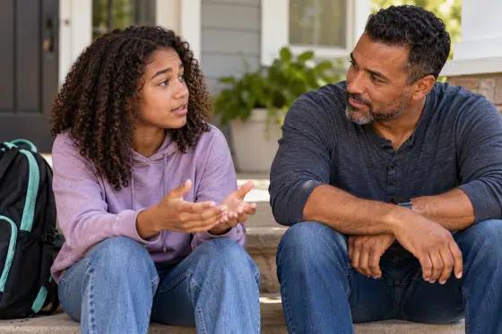Stepdad listening to his stepchild talk about problems at school